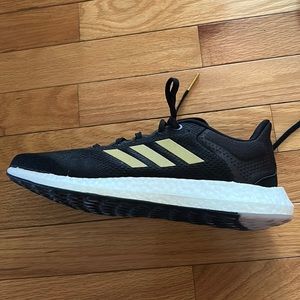 Adidas women’s shoe size 9.  Like new. Black and gold